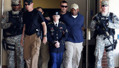 U.S. Army Private First Class Bradley Manning (3rd L) departs after day two of his court-martial at Fort Meade, Maryland June 4, 2013.(Reuters / Gary Cameron)